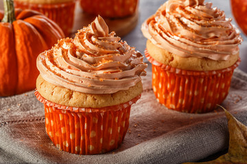 Pumpkin cupcakes with glitter sugar sprinkles.
