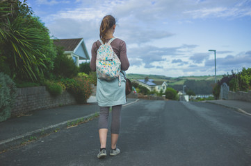 Fototapeta premium Young woman in the suburbs