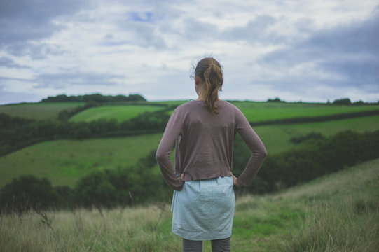 Young woman standing in countryside