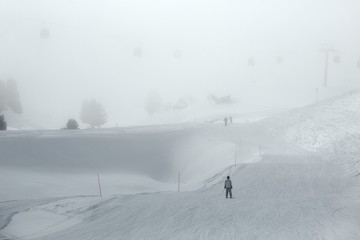 Skiing slopes in fog