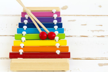 Wooden toy xylophone in rainbow colors. Educational toy for kids