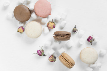 Fototapeta na wymiar Multicoloured macaroons and marshmallow