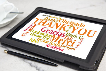 tablet with thank you word cloud