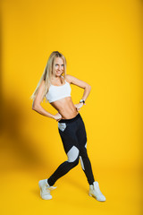 Fototapeta na wymiar Slim and slender dancing young woman. Sporty body. Fitness. 