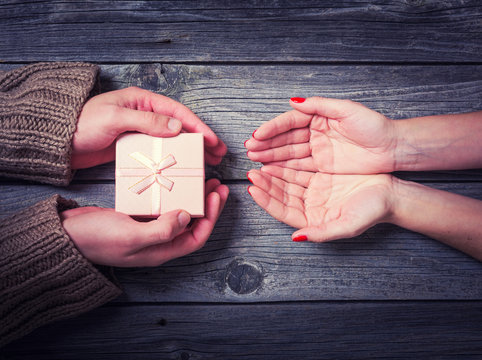 Man Giving Woman A Christmas Gift