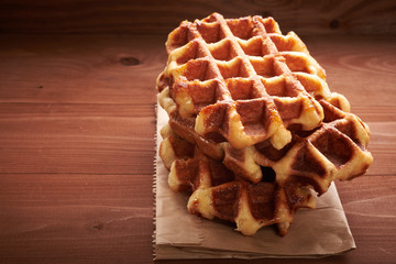 Belgian waffles on a wooden table