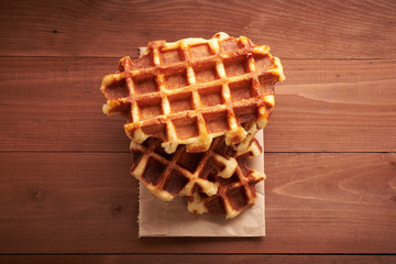 Belgian waffles on a wooden table