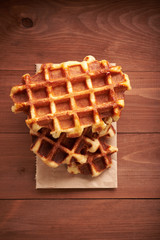 Belgian waffles on a wooden table