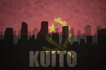 abstract silhouette of the city with text Kuito at the vintage angolan flag