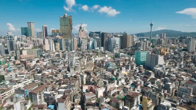 Flying over the old city center of Macau towards the famous casino buildings