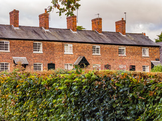 Styal, Wilmslow Cheshire, UK. Novermber 7th 2016. Autumn colours over mill cottages at Styal...
