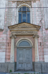 door of beautiful old large house. Columns, windows, moldings