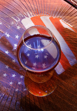 american flag reflected in the glass of whiskey