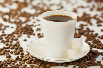 coffee in coffee cup with natural grains