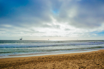 Oceanic Oil Rigs off the Beach Coastline