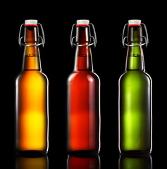Set of beer bottles isolated on black background