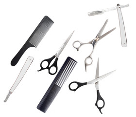 Comb with scissors and razor on a white background