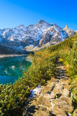 Fototapeta na wymiar Morskie Oko lake in autum colors and snow peaks, Tatra Mountains, Poland