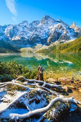 Morskie Oko lake in autum colors and snow peaks, Tatra Mountains, Poland - obrazy, fototapety, plakaty