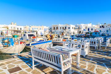 Typical Greek taverna tables in Naoussa port, Paros island, Greece