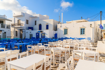 White and blue taverna tables on square in Naoussa port, Paros island, Greece