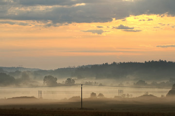 Dawn over rural countryside