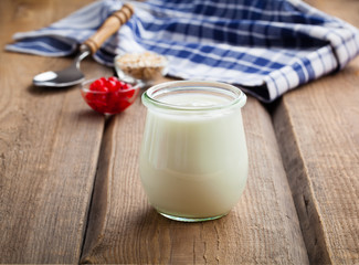 natural yoghurt on a wooden background