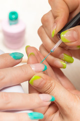 women in a beauty salon manicure