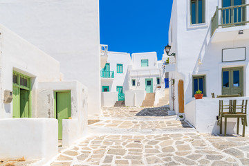 Street with white Greek houses in Naoussa town, Paros island, Greece