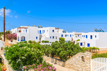 Fototapeta premium View of street with typical Greek holiday apartments in Naoussa town, Paros island, Greece