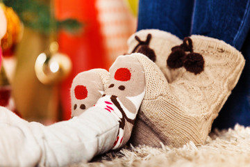 Christmas time. Happy family is enjoying living room. Close up. 