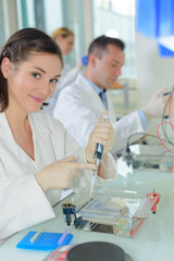 Laboratory technician using pipette