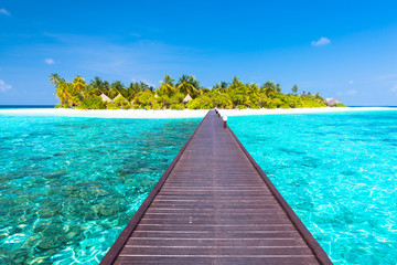 Fototapeta na wymiar Angaga Resort. Maldives. Tropical island in the Indian Ocean. White sand beach with palm trees.