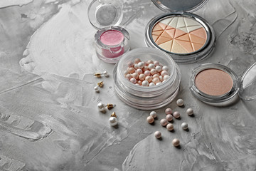 Decorative cosmetic set on grey textured background