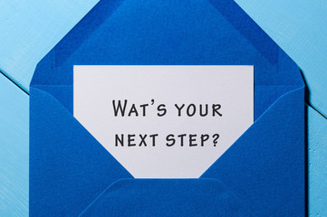 Hand writing text What is Your Next Step in letter with blue envelope