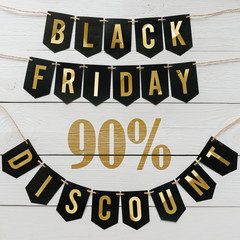 Black Friday ninety percent Discount paper banner garland lettering hanging on white barn wood...