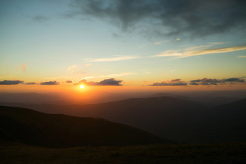 Fototapeta na wymiar Beautiful mountain peaks with sunset