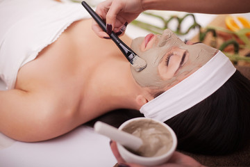 Spa therapy for young woman having facial mask at beauty salon - indoors © Maksymiv Iurii