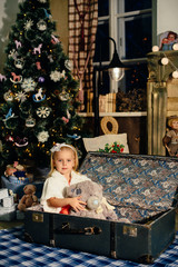 little girl in a New Year's decor, baby and Christmas 1
