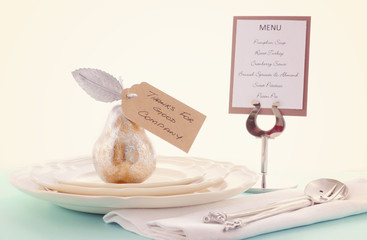 Thanksgiving table setting with gold pear.