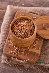 buckwheat groats on wooden surface