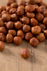 hazelnuts on wooden surface