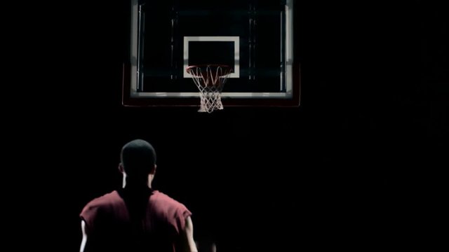 Medium shot of a basketball player shooting the ball