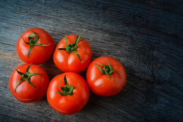 Fresh tomatoes on the table in natural light