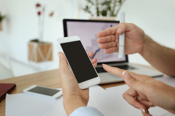 Somebody shows something on the phone screen. Humans hands
