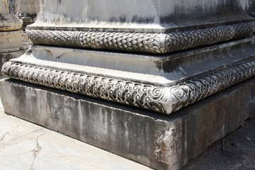 Elaborately decorated bases of the massive columns  of the Apoll