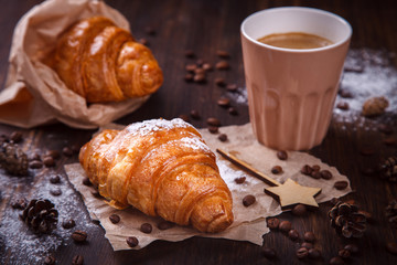  Christmas or New Year pastries,Croissant with a warming drink,coffee.Winter Holidays Concept.Holiday Decorations. top view.Vintage style. selective focus.