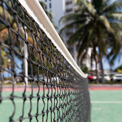 Outdoor tennis net at court with nobody