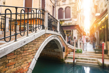Fototapeta na wymiar Typical bridge in Venice at sunset - Italy, Europe