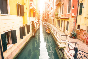 Fototapeta na wymiar Typical canal with colorful houses and boats in Venice, Italy, Europe